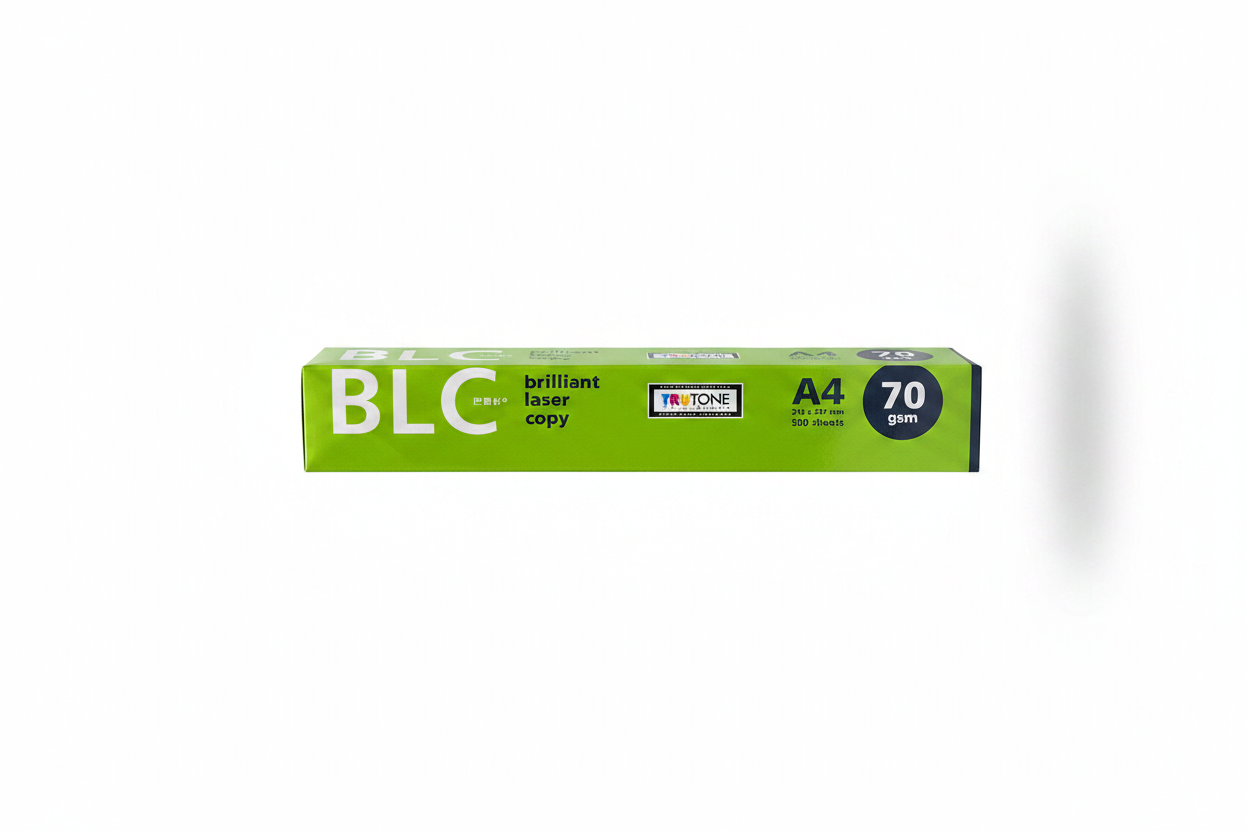 A bright green box of BLC Brilliant Laser Copy A4 70g paper, standing upright in a retail display filled with other office and art supplies.