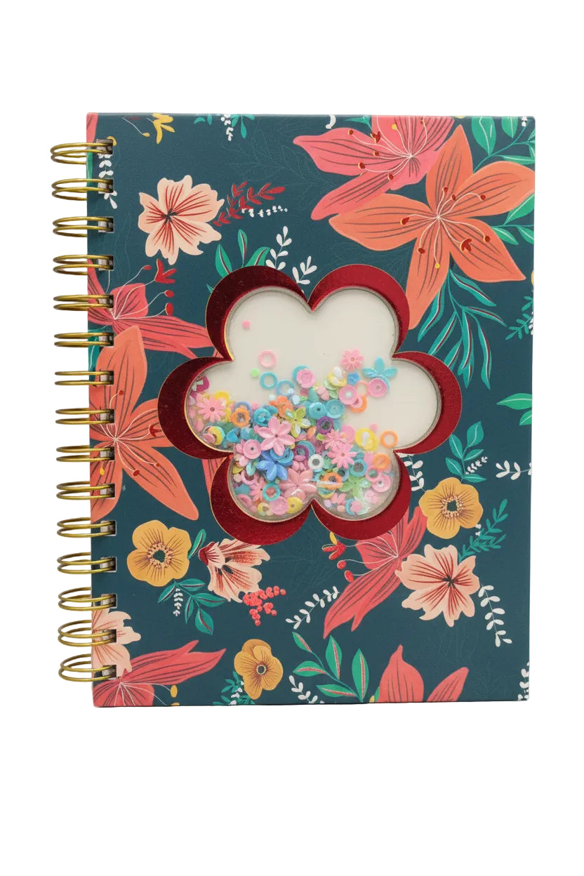 Base color: Dark teal/navy backgroundPrint: Large tropical flowers in coral, peach, and mustard yellow + green leaves scattered all overShaker: Center has a red flower-shaped clear window. Inside it are moving sequins - tiny circles, flowers, hearts in pink, blue, purple, yellow, greenBinding: Gold metal spiral on the left sideVibe: Bold floral + "satisfying" shaker element. The sequins move when you tilt it