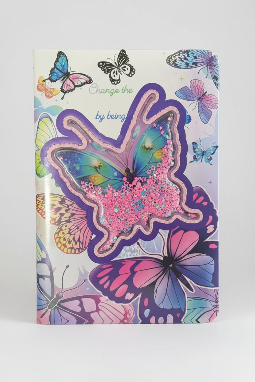 Notebook with butterfly design and colorful embellishments on a cluttered background