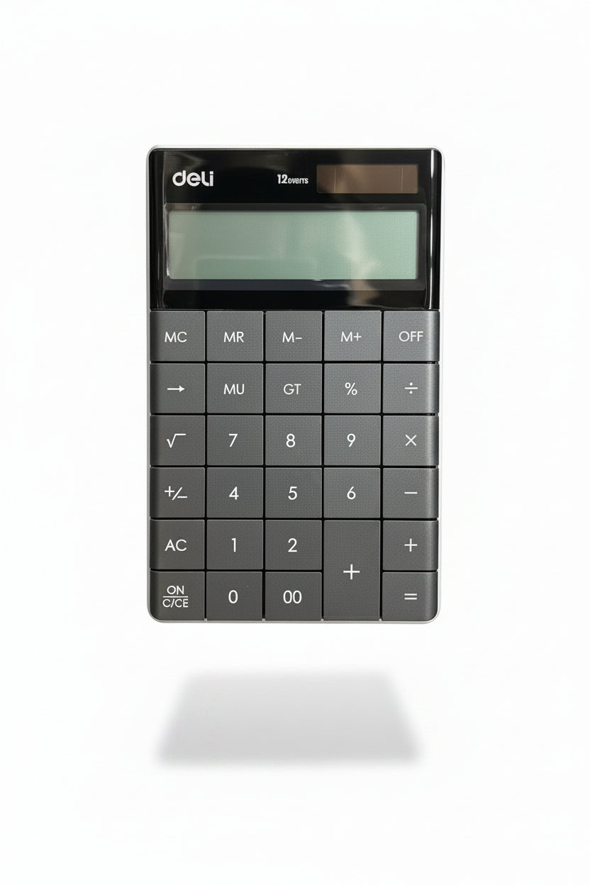 A hand holding a black and gray Deli 12-function calculator, with a cluttered background of shelves and boxes.